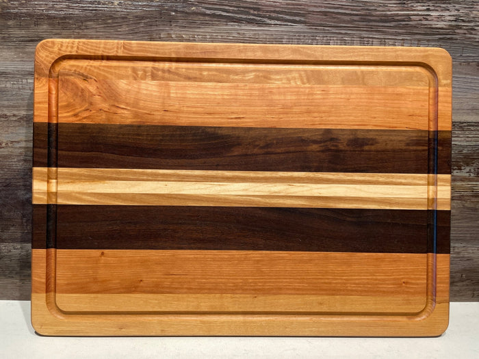 Montana Block Company 14x20 flat cutting board with juice groove, featuring a smooth wooden surface and integrated juice channel.