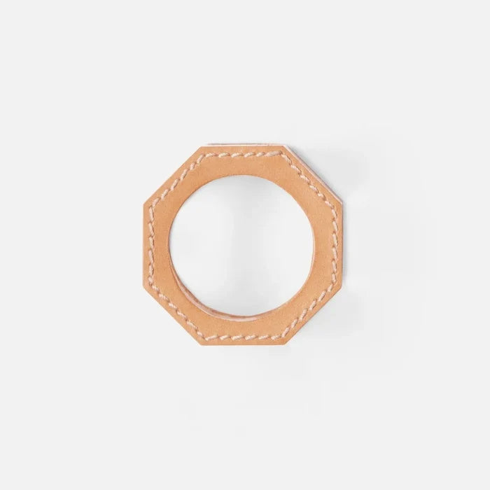 The Arthur Leather Camel Napkin Ring Set of 4 by Blue Pheasant features tan, octagonal full-grain leather napkin rings with visible white stitching, shown against a plain white background.