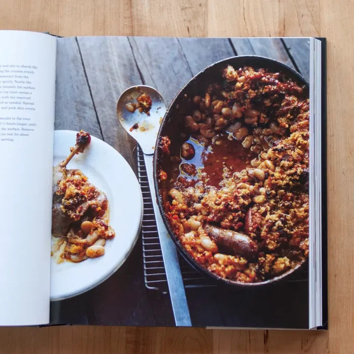Open cookbook titled "In the Charcuterie" from Penguin Random House LLC, featuring pages with charcuterie recipes and illustrations.