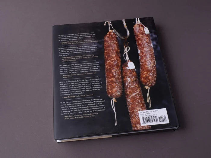 Open cookbook titled In the Charcuterie from Penguin Random House LLC, featuring pages with charcuterie recipes and images.