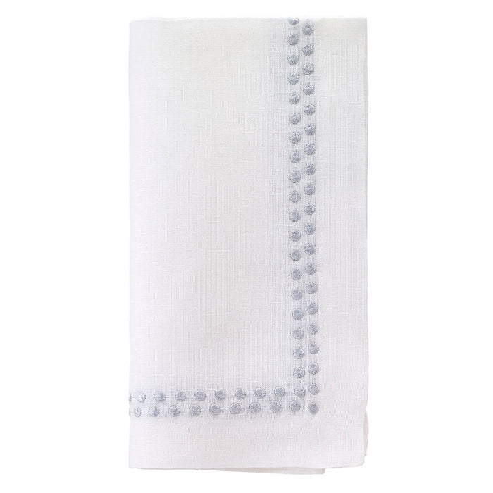 The Bodrum Pearls Napkin Silver Set of 4 is crafted from fine linen and features small, evenly spaced silver embroidered dots along two edges.