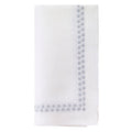The Bodrum Pearls Napkin Silver Set of 4 is crafted from fine linen and features small, evenly spaced silver embroidered dots along two edges.