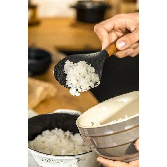 Staub Rice Spoon from 1616 Cooking Utensils collection, stainless steel with a wooden handle, designed for serving rice.