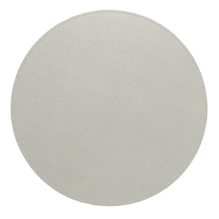 The Kim Seybert Shagreen Placemat Elephant Grey Set of 4 features plain, round placemats with a light textured finish, shown from above on a white background.
