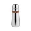 The Nambe Tahoe Cocktail Shaker features shiny stainless steel with a rounded cap and a brown leather strap around the neck, shown against a plain white background.